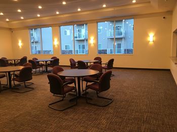 A large room with tables and chairs